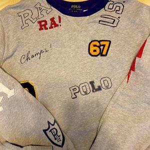 Boys XL Polo sweatshirt with graphics and patch.